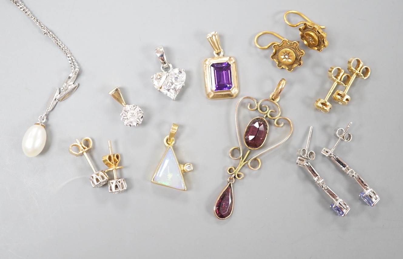 Mixed jewellery including a pair of Victorian 15ct and diamond chip earrings, a modern amethyst pendant, a garnet set yellow metal pendant, two pairs of 750 and diamond set ear studs, a pair of 750 white metal, tanzanite
